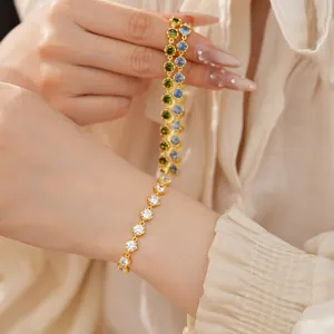 Close-up of 18k gold plated bracelets with round cubic zirconia in various colors