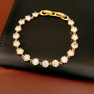 Detailed view of an 18k gold plated bracelet with sparkling round cubic zirconia stones