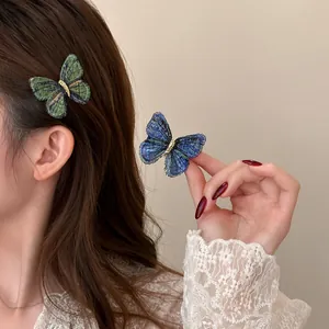 Elegant vintage knitted butterfly hair clip accessories displayed on model hair and hand