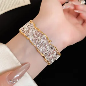 Macro view of French romantic lace textured open bracelet with sparkling rhinestones