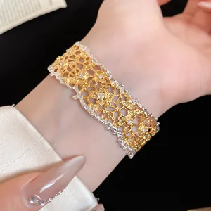 Detailed macro view showing the intricate lace texture of the two-tone pave bangle
