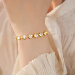 Detailed view of an 18k gold plated bracelet featuring sparkling round zircons
