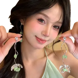 Elegant fairy-style long tassel earrings with green beads and clear flower charms