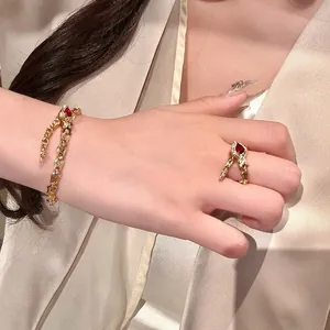 Elegant vintage snake bone bracelet and pigeon blood red stone ring set on model