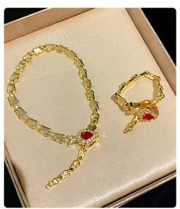Elegant vintage snake bone bracelet and pigeon blood red ring jewelry set in gold