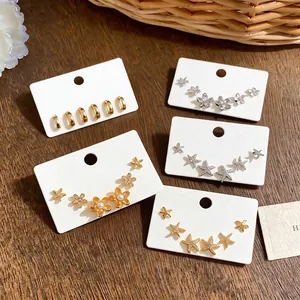 Elegant zircon starfish and flower stud earring set in gold and silver finishes.