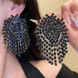 Detailed view of luxury black rhinestone tassel earrings with geometric design