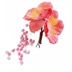 Pink fabric flower hair clip with elegant tassels in a New Chinese classical style.