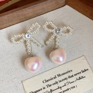 Elegant French style bow earrings with heart-shaped pearls and zircon stones luxury