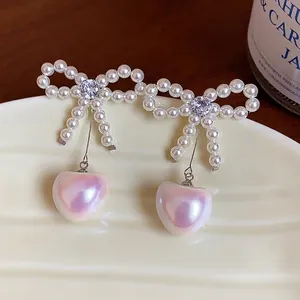 French style bow pearl earrings with heart-shaped pearl drop and zircon detail