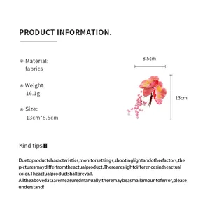Detailed specifications for the pink fabric flower tassel hair clip with dimensions