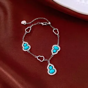 Elegante bracciale a forma di zucca con pietre turchesi e zirconi brillanti in argento