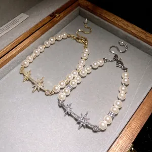 Elegant 18k gold plated pearl bracelet with zircon north star charms in a gift box.