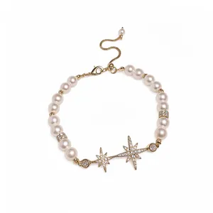 Elegant 18k gold plated pearl bracelet featuring zircon starburst charms for women