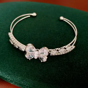 Detailed close-up of a silver-tone double-layered butterfly cuff bracelet with sparkling zircons