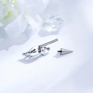 Polished F136 titanium angel wing piercing stud with a secure screw-on cone spike