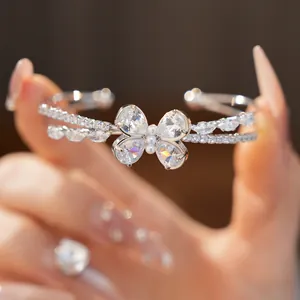 Close-up of elegant double-layer butterfly bangle with sparkling cubic zirconia stones