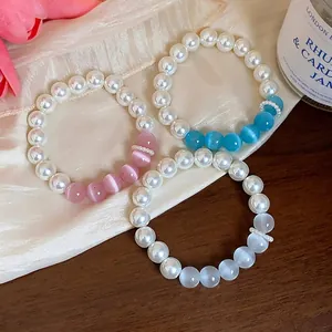 Elegant pearl and cat-eye bead bracelet set with a sweet, minimalist aesthetic for women.
