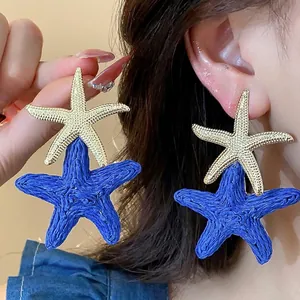 Elegant gold and blue raffia starfish drop earrings for stylish summer beach vacations