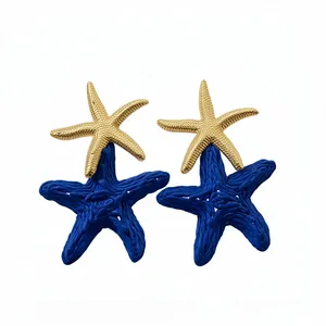 Elegant blue raffia and gold metal layered starfish earrings for stylish beach vacation looks