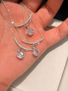 Macro detail of elegant silver necklace with sparkling zircon flower and star pendant decoration