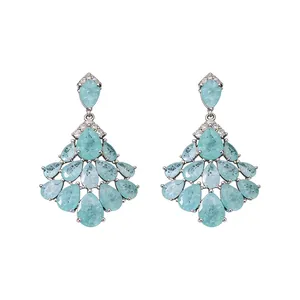 Elegant vintage 14k gold-plated silver pin earrings with light blue teardrop zircons.