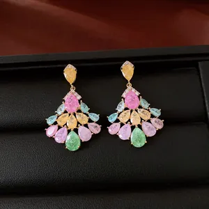 Close-up of vintage multi-color zircon teardrop earrings in a premium black jewelry box