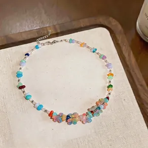 Detailed view of colorful dopamine-style resin flower and stone beaded necklace