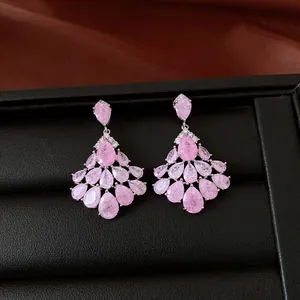 Detailed macro view of elegant luxury vintage teardrop earrings with pink zircon stones