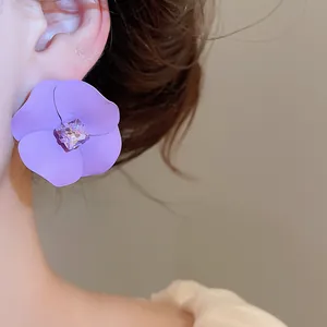 Exquisite purple matte flower stud earring featuring a sparkling square center crystal