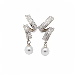 Elegant silver post earrings featuring baguette zirconia and white round pearls decoration