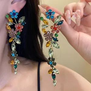 Detailed view of colorful crystal flower tassel earrings for a luxury fashion look