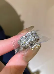 Close-up of sparkling zircon lace-edge open ring with baguette stones