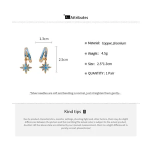 Details of gold star dangle earrings with blue zircon stones and measurement specs