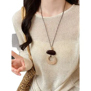 Bohemian woven necklace with wood bead and rattan ring pendant for beach vacation