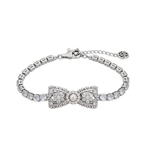 Elegant silver-toned bowknot bracelet featuring sparkling zircons and a pearl.