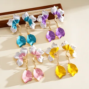 Detailed view of colorful oil-dripping flower petal earrings in various vibrant shades.