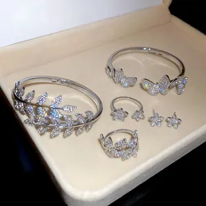 Detailed view of cubic zirconia leaf and butterfly jewelry set in a gift box