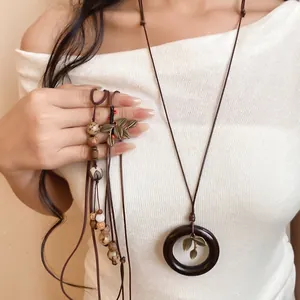 Long collier de style rétro néo-chinois avec anneau en bois et graines de bodhi