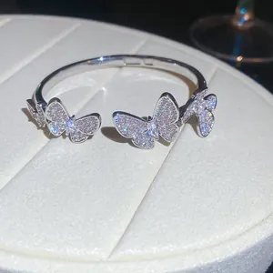 Detail view of a silver butterfly bangle encrusted with shimmering cubic zirconia stones
