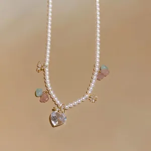 Elegant pearl necklace with zircon heart crystal and golden butterfly charms