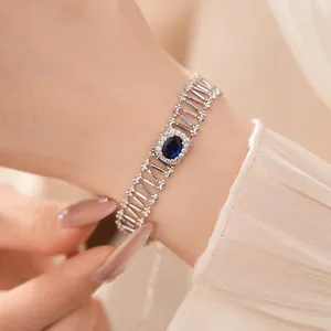 Elegante pulsera de plata calada de lujo con circón azul ovalado central y cristales
