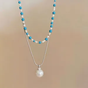 Collana a doppio strato con perline blu e ciondolo a perla su catena d'argento