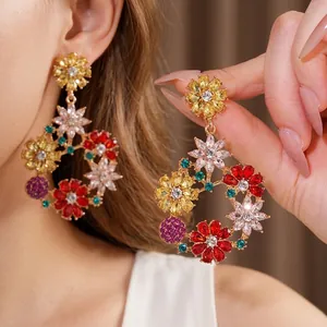 Vintage floral hoop earrings with colorful rhinestones and gold-tone finish for women