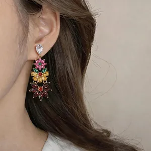 Luxury vintage multi-color crystal flower tassel earrings shown on a female model