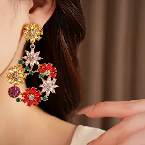 Close-up detail of vintage floral wreath earrings featuring vibrant colorful crystals