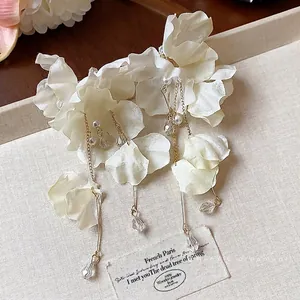 Elegant white fabric flower tassel earrings with pearls and crystal droplets for summer.
