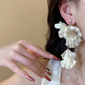 Elegant fabric flower drop earrings with pearls and tassels for a stylish summer look