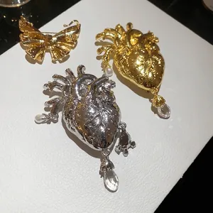 Vintage metal anatomical heart and butterfly brooches with pearl drops for women