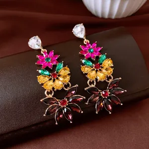 Detailed shot of vintage multi-color crystal flower tassel drop earrings in gold-tone.